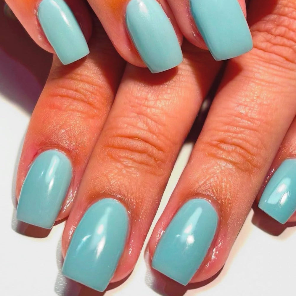 Mint green nail set on white background