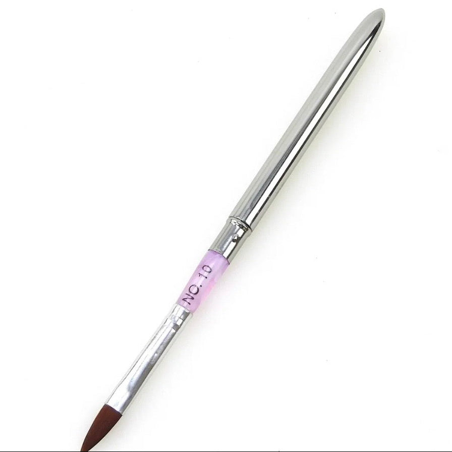 Nail brush with a metallic handle and brown bristle tip on a white background