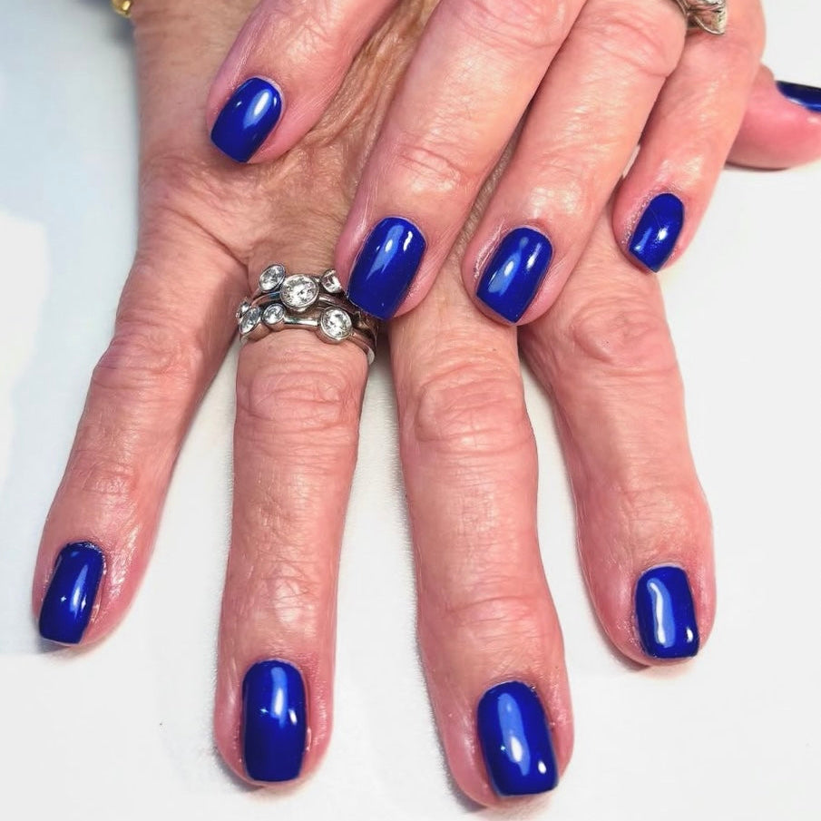 Denim blue nail set on a white background