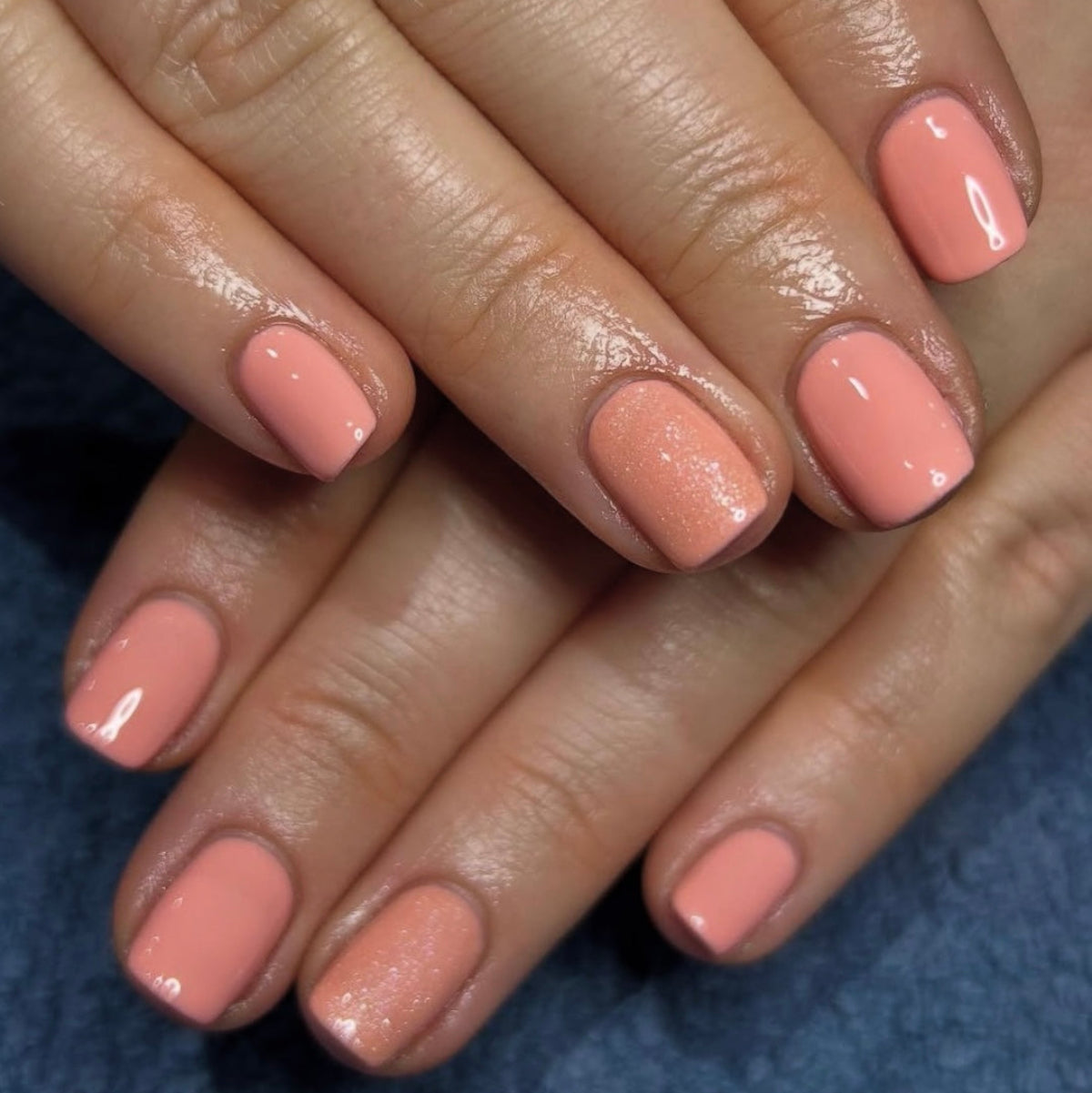 Close-up of hands with pink nail polish 