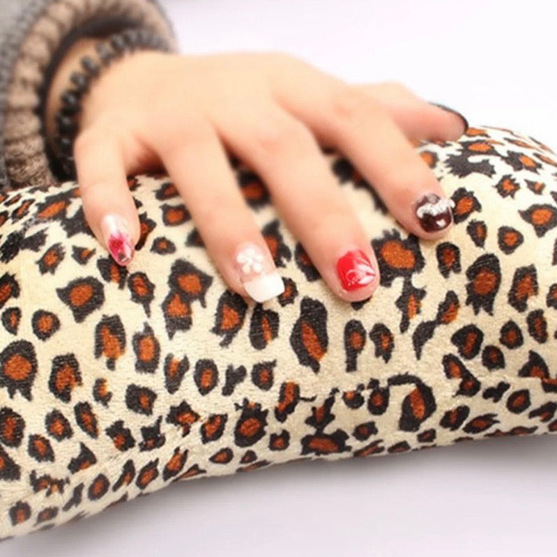 Leopard print nail cushion for comfort during nail treatment 