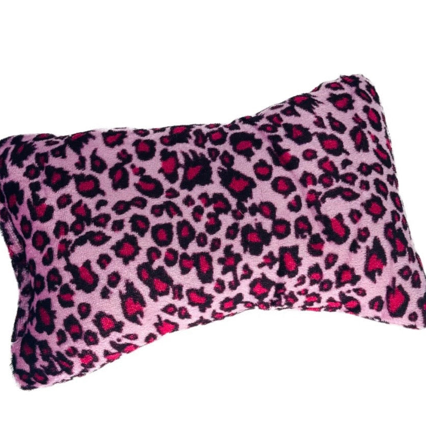 Pink leopard print pattern nail cushion on a white background 