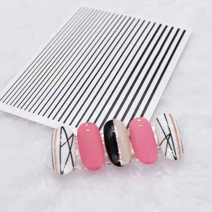 Pink and black nail art stripes  on a white background