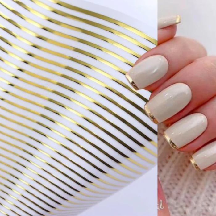 Nail art design with gold accent on a white background