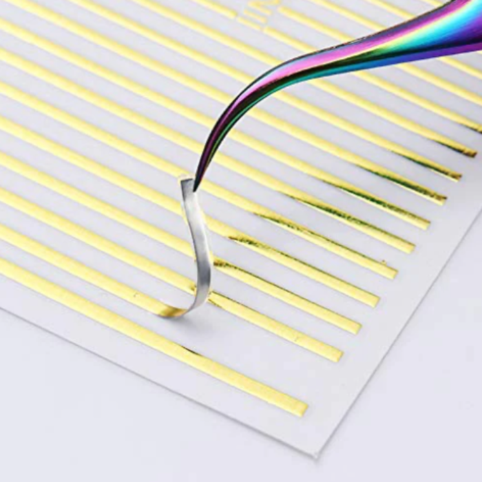 Metallic gold stripe stickers with a rainbow picker on a white background 