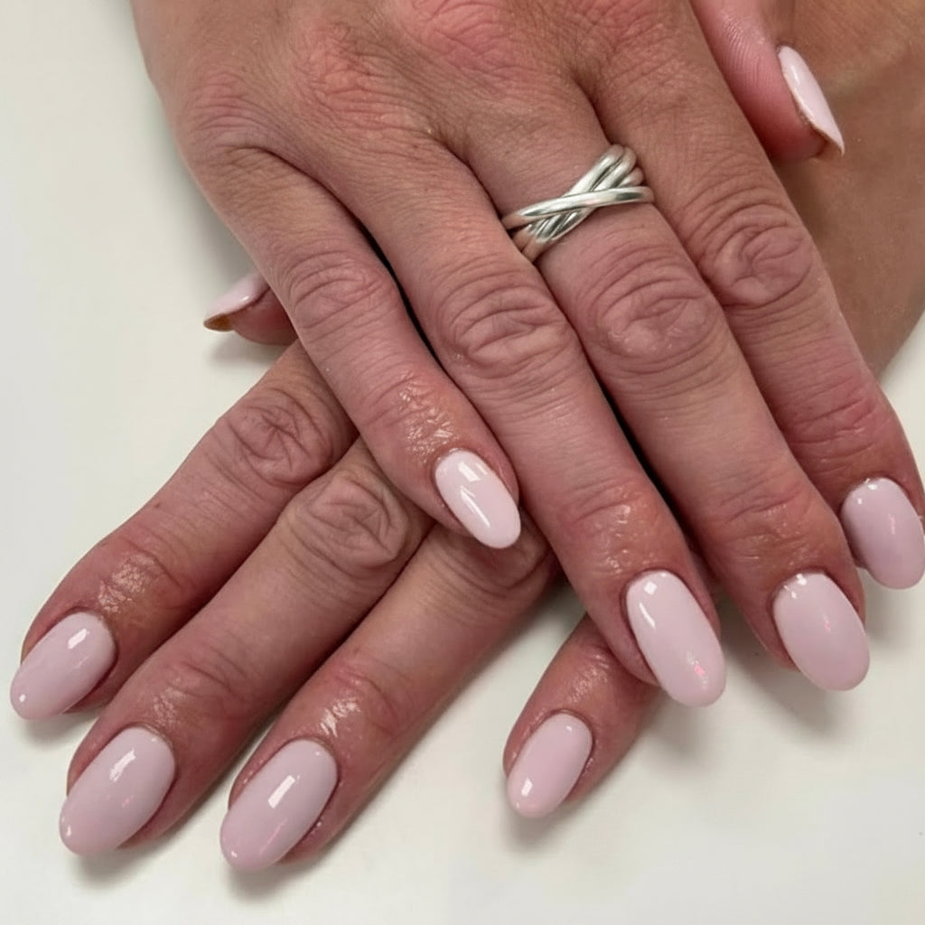 Close-up of hands with pink nail polish on a white background, featuring the brand 'Nails & Beauty by Becky'.
