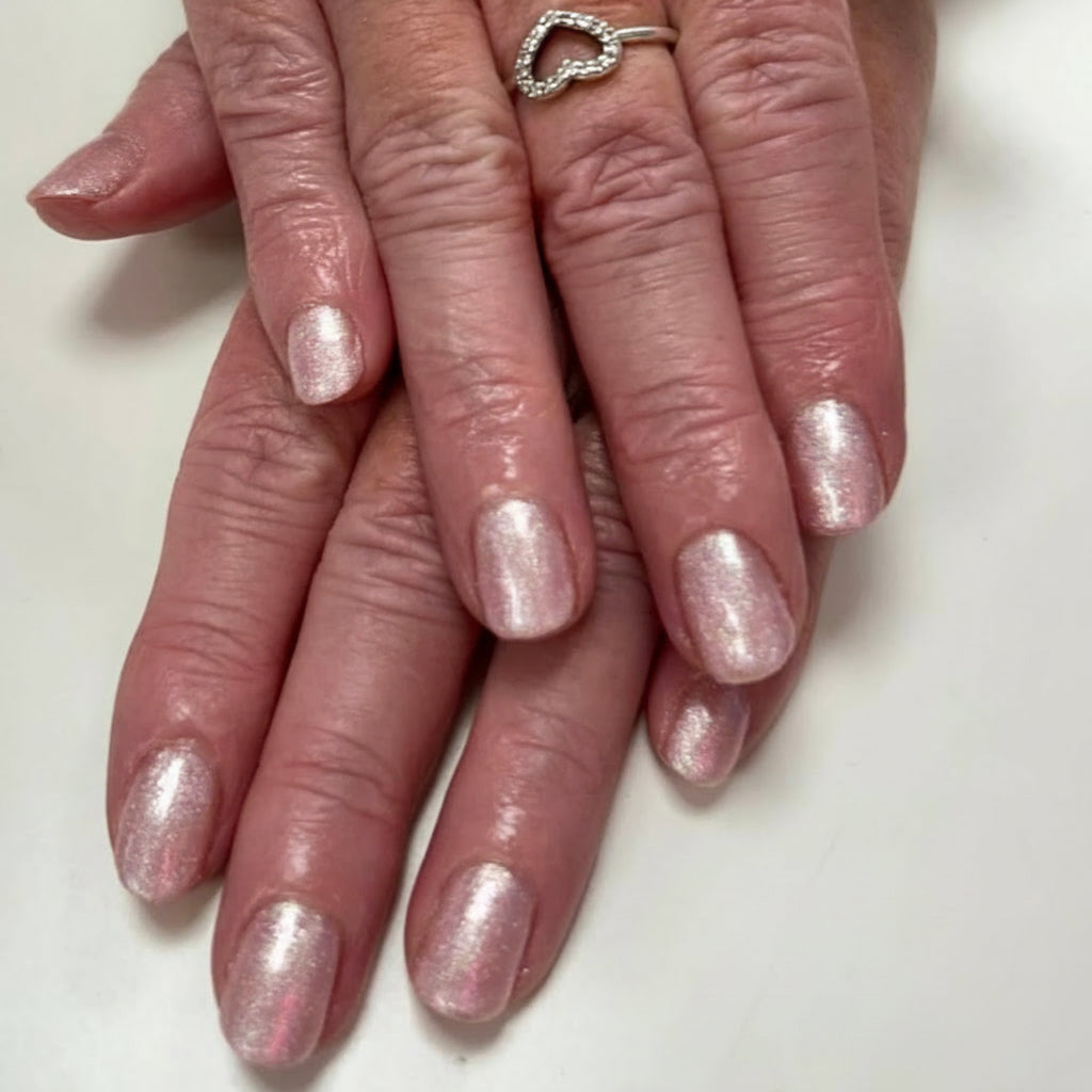 Shimmery pink gel polish on a nail set 