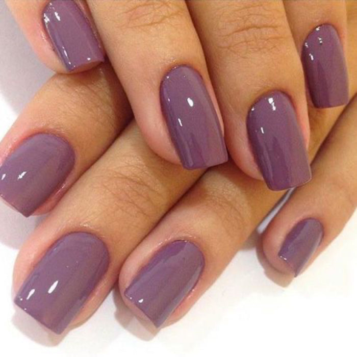 A nail set showing a purply colour on a light back ground
