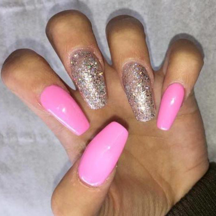 Hands with pink and glittery silver nail polish